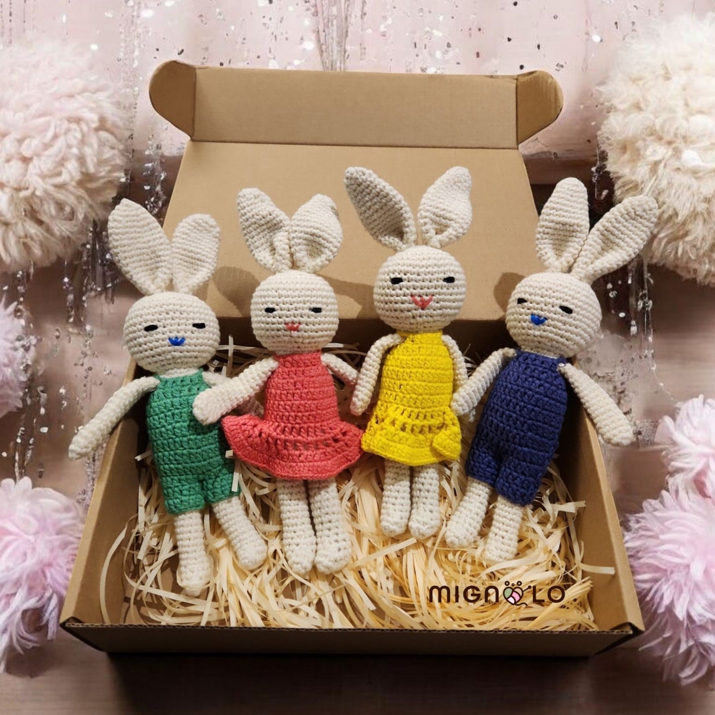 Handmade crochet bunny amigurumi in pink and yellow green blue dresses