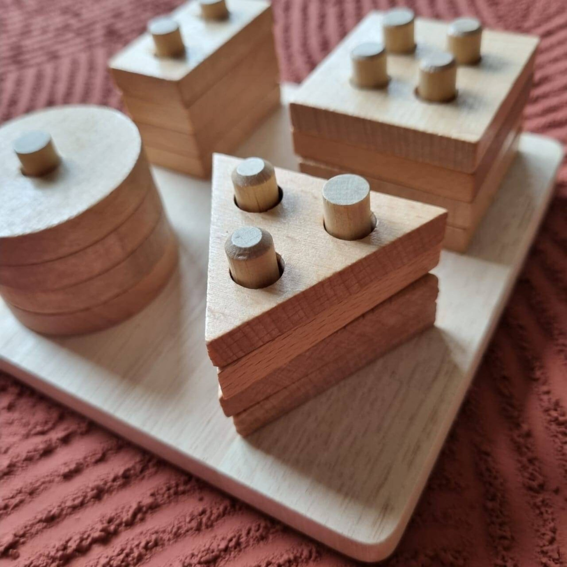 Wooden shape sorting toy support motor skill development