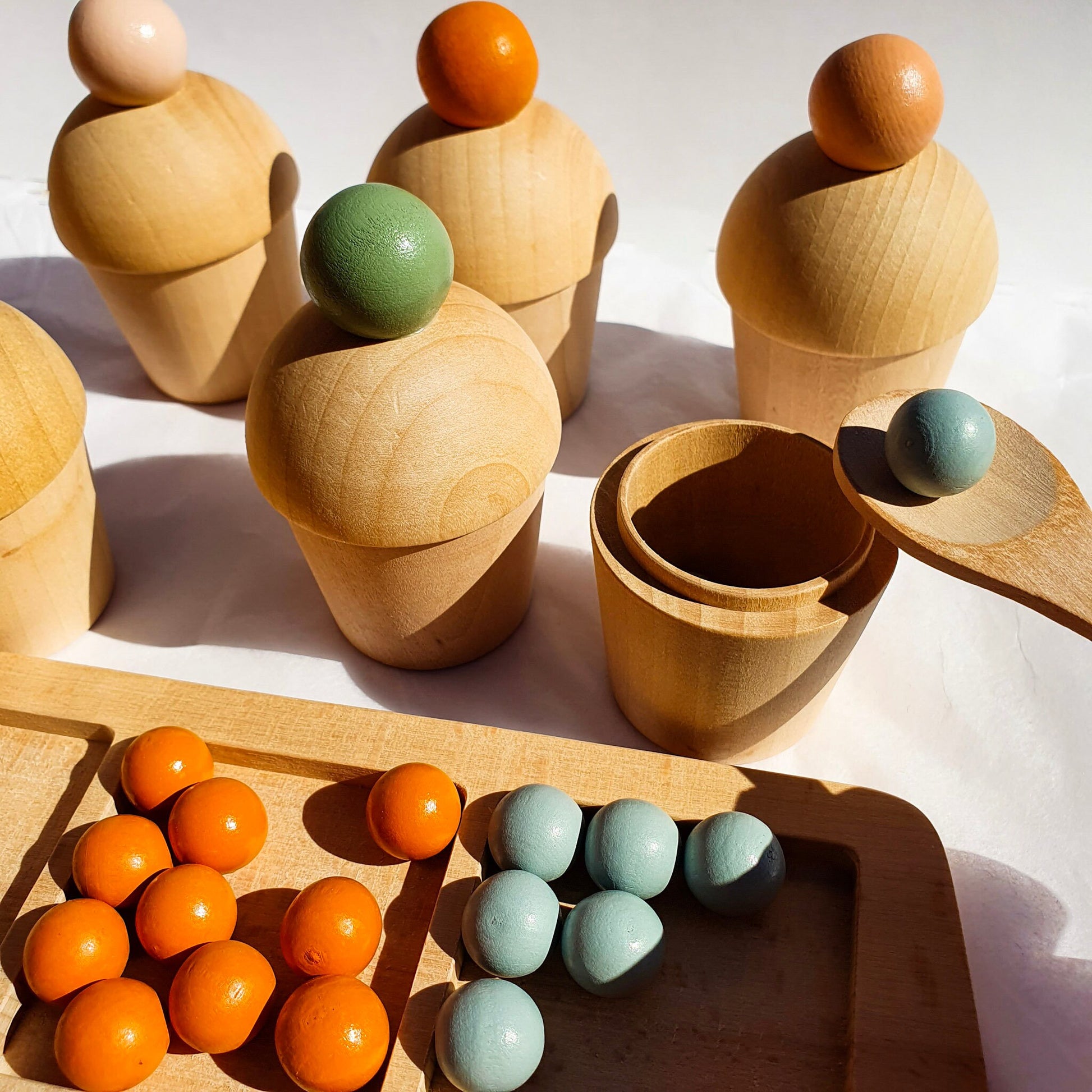 Montessori marble sorting activity showing fine motor skill development